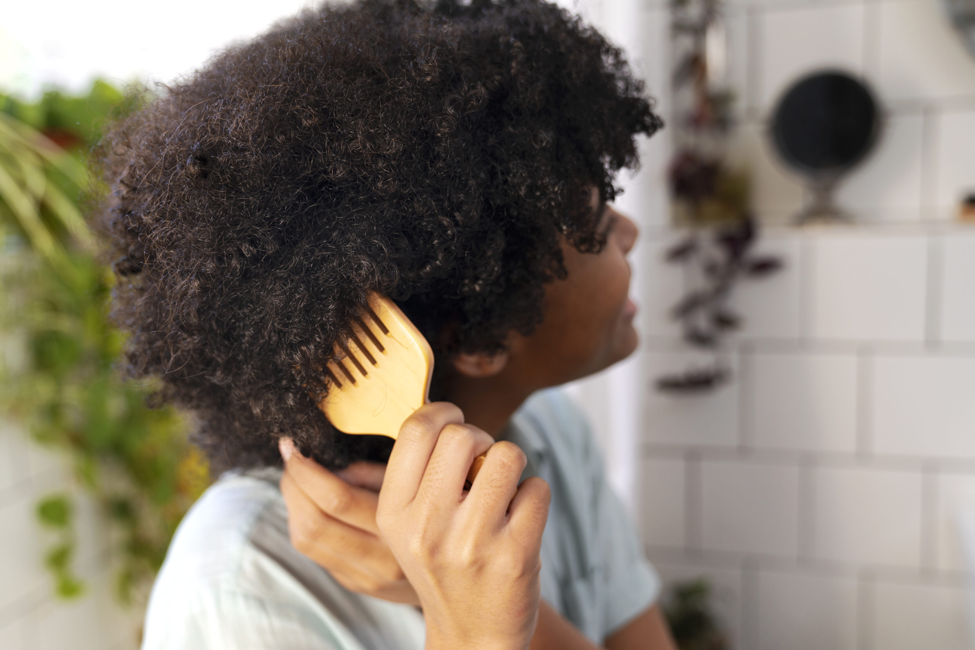 young-black-person-taking-care-afro-hair (2)